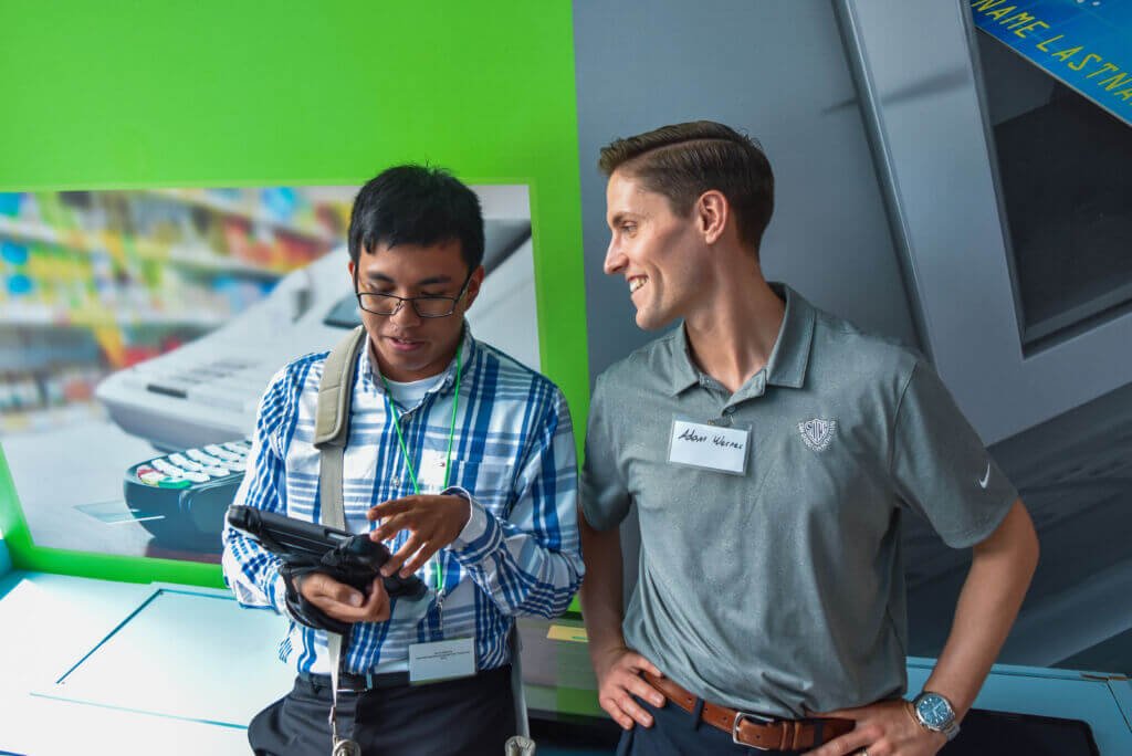 staff and boy in JA program